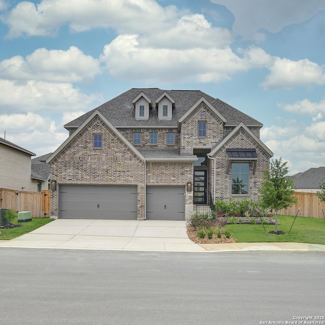 view of front of property featuring brick siding, driveway, an attached garage, and roof with shingles