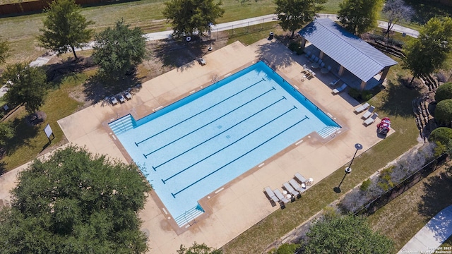 aerial view of property and surrounding area with a pool