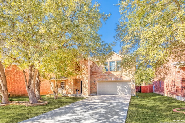 view of front of property featuring a garage and a front yard