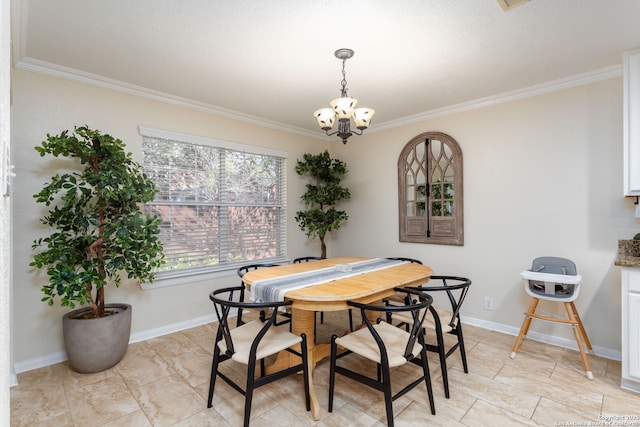 dining space featuring ornamental molding and a chandelier