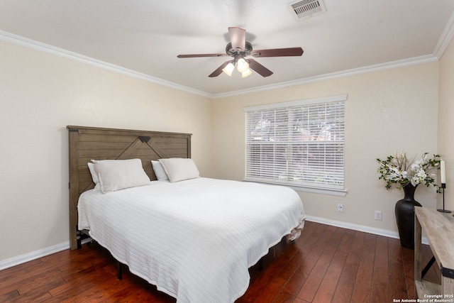 bedroom featuring crown molding, dark hardwood / wood-style floors, and ceiling fan