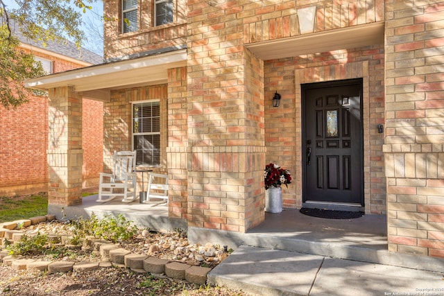 doorway to property featuring a porch