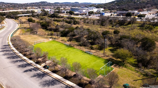 birds eye view of property with a mountain view