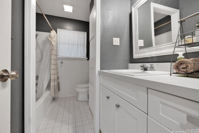 full bathroom featuring shower / tub combo, vanity, toilet, and tile patterned flooring