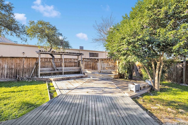 wooden terrace with a pergola and a lawn