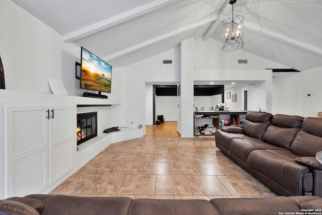 living room featuring beam ceiling, high vaulted ceiling, a textured ceiling, and a notable chandelier