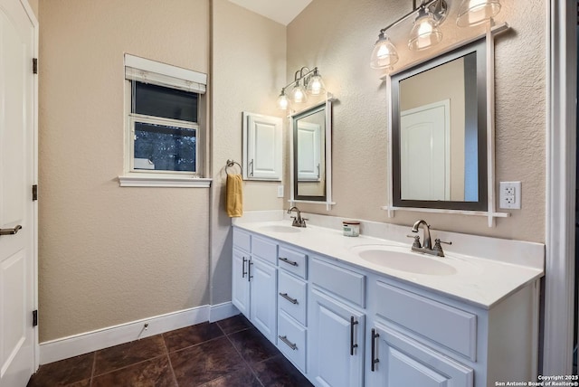 bathroom featuring tile patterned flooring and vanity