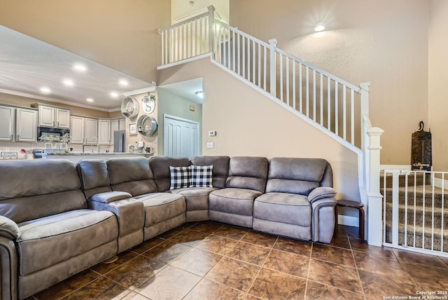 living room featuring crown molding