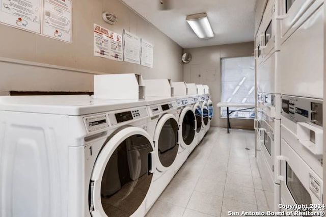 washroom featuring washing machine and clothes dryer and stacked washing maching and dryer