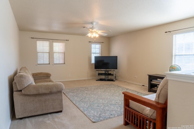 living room featuring carpet and ceiling fan