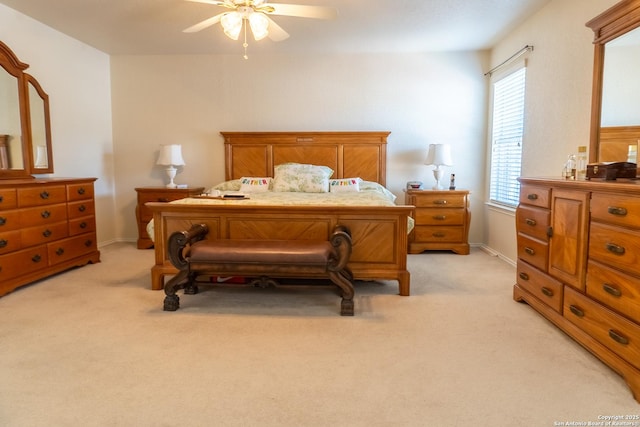 bedroom featuring ceiling fan and light carpet