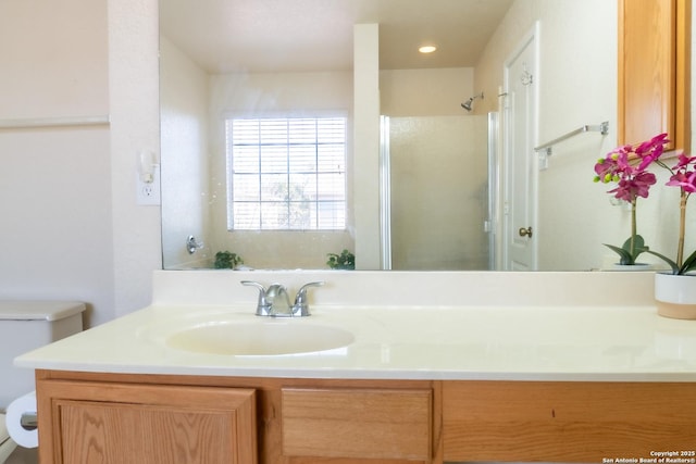 bathroom with vanity, toilet, and walk in shower