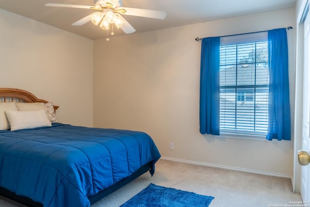 bedroom with light carpet and ceiling fan