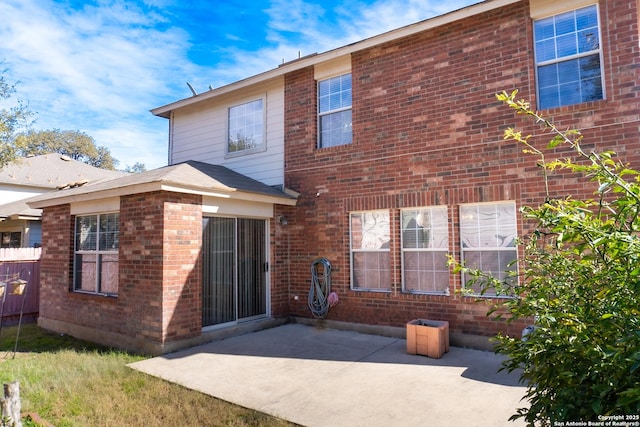 rear view of house featuring a patio