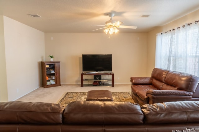 living room with ceiling fan and light carpet