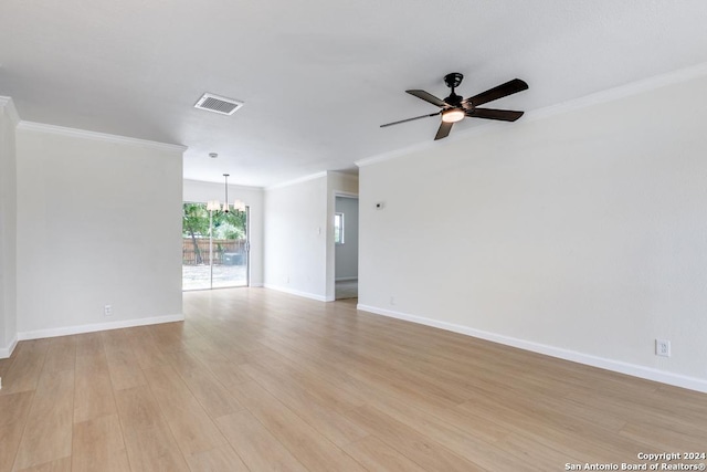 empty room with ornamental molding, ceiling fan with notable chandelier, and light hardwood / wood-style floors