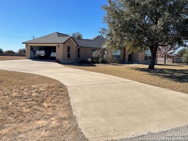 view of front facade with a garage and a front lawn