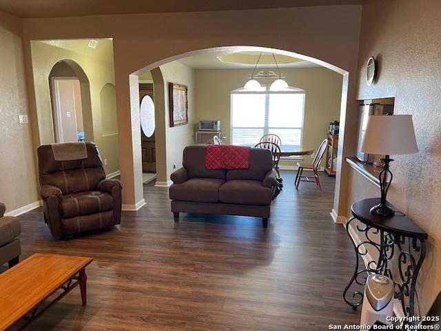 living room with dark wood-type flooring