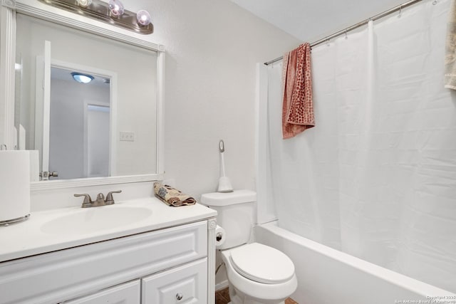 full bathroom with vanity, shower / bath combo, and toilet