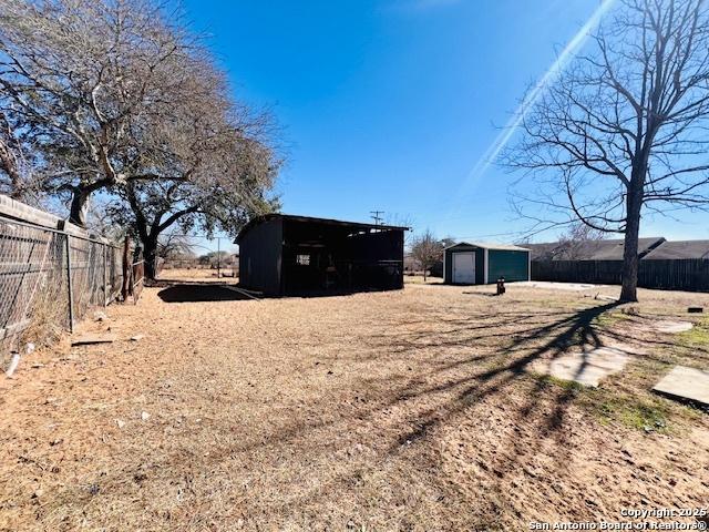 view of yard with an outdoor structure