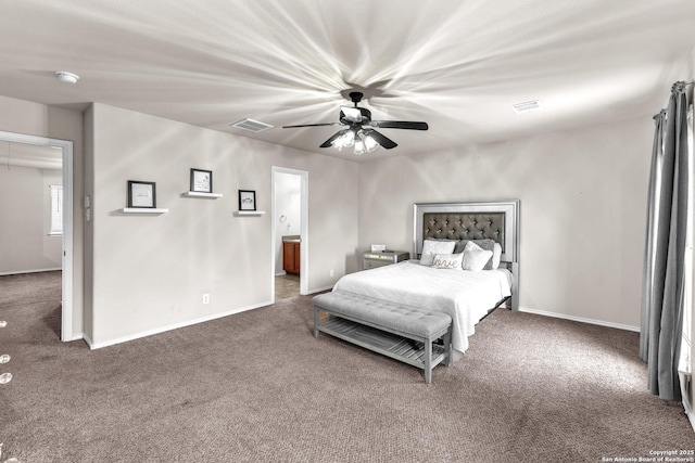 bedroom with connected bathroom, ceiling fan, and carpet flooring