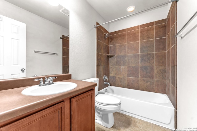 full bathroom featuring tiled shower / bath combo, vanity, and toilet