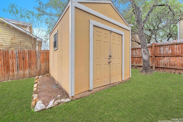 view of outbuilding featuring a yard