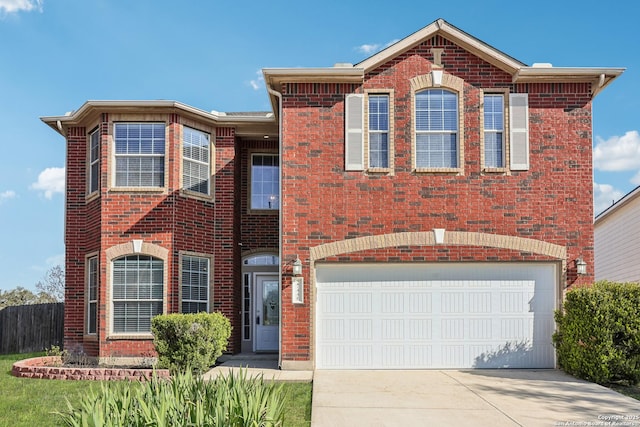 traditional-style home featuring concrete driveway, brick siding, and an attached garage