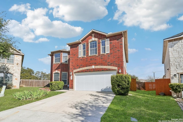 view of front of house with brick siding, a front yard, and fence