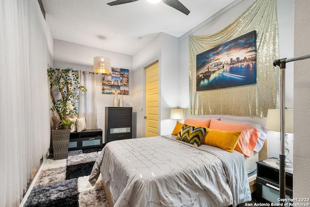 bedroom with ceiling fan and carpet floors