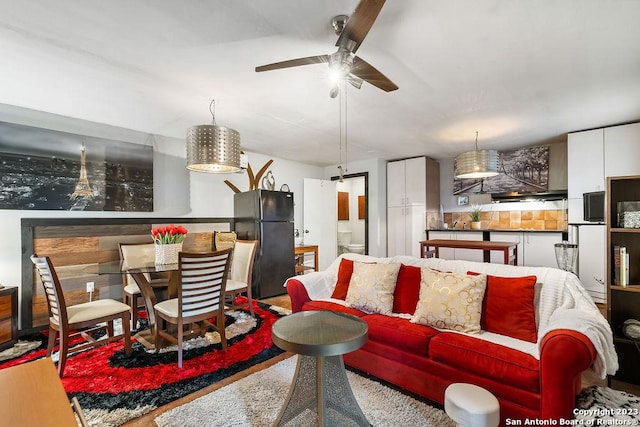 living room featuring ceiling fan