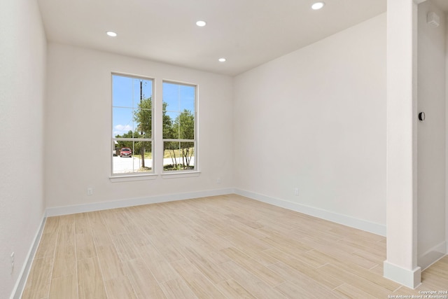 unfurnished room featuring light hardwood / wood-style flooring