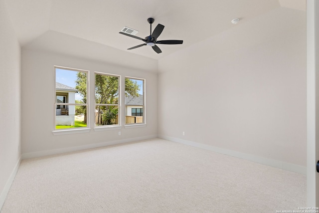 carpeted spare room with ceiling fan