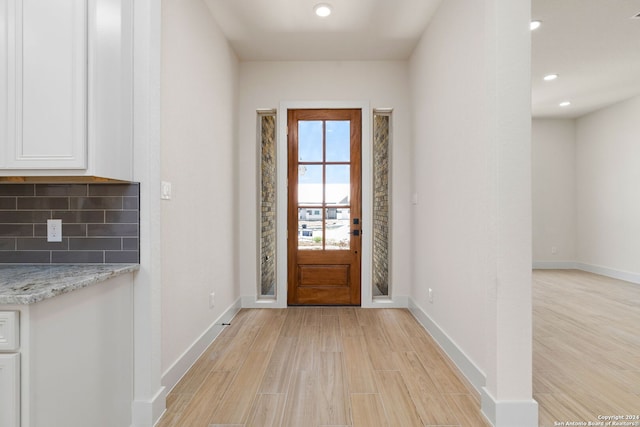 foyer entrance featuring light wood-type flooring