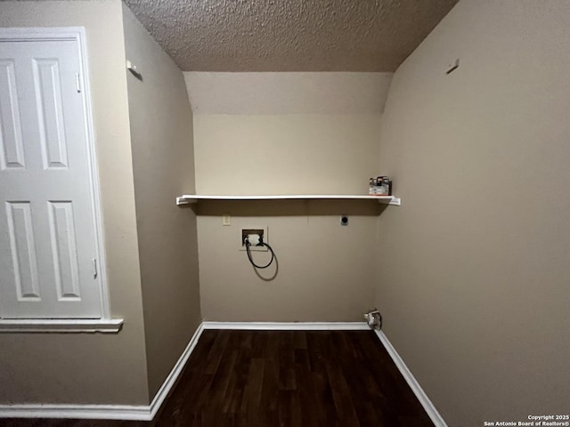 laundry room with washer hookup, dark hardwood / wood-style floors, hookup for an electric dryer, and a textured ceiling