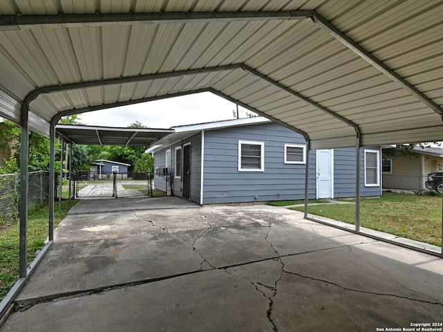 view of car parking with a carport and a yard