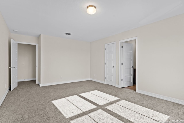 unfurnished bedroom with light carpet