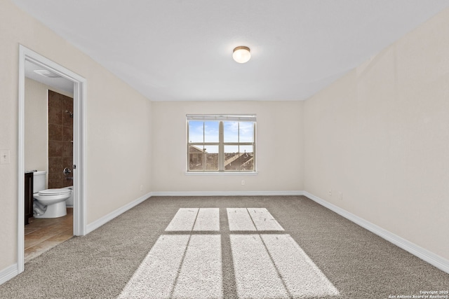 unfurnished room featuring carpet floors