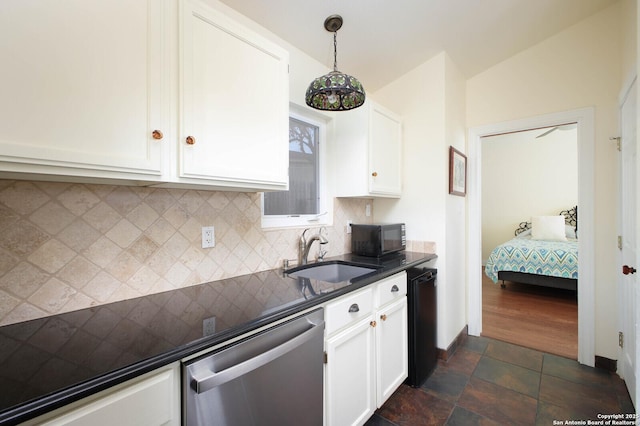 kitchen with white cabinetry, sink, hanging light fixtures, and dishwasher