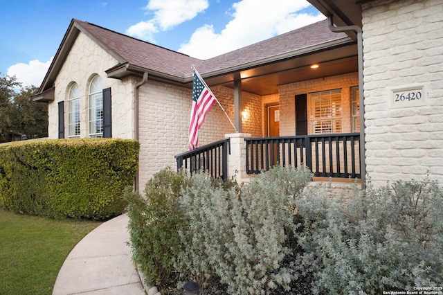 doorway to property featuring covered porch