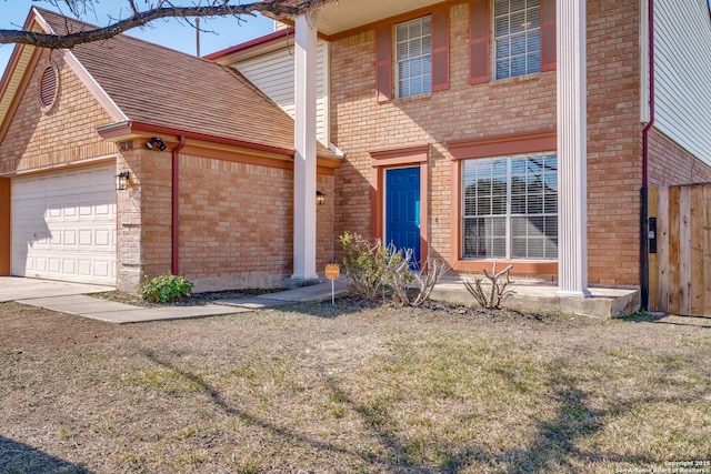 view of front of house featuring a garage and a front yard