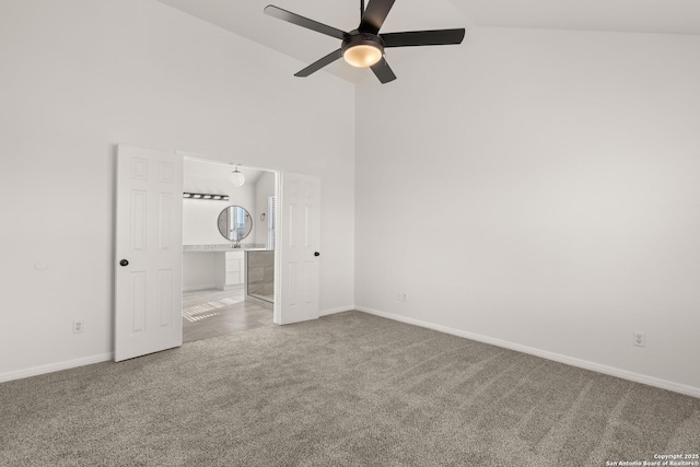 unfurnished bedroom with carpet, high vaulted ceiling, ceiling fan, and ensuite bath