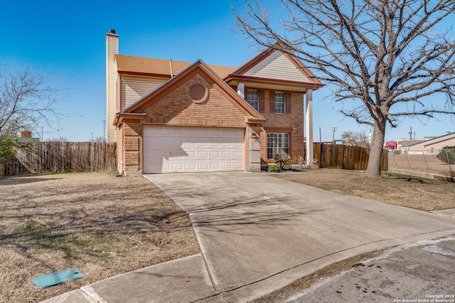 view of front property featuring a garage and a front lawn