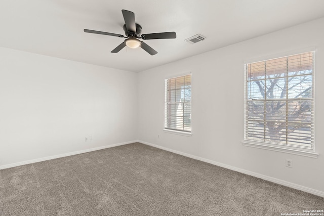 carpeted empty room with ceiling fan