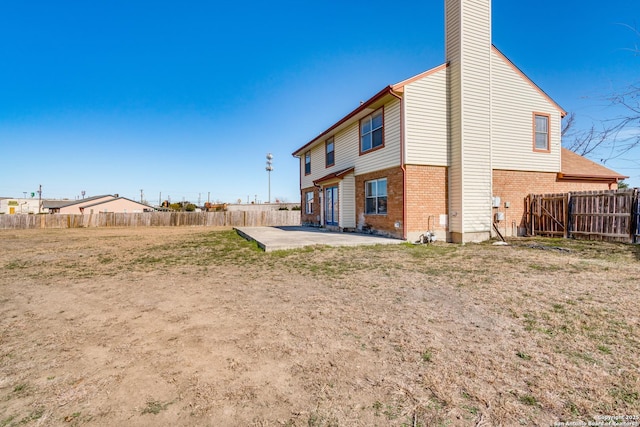 back of house featuring a patio area