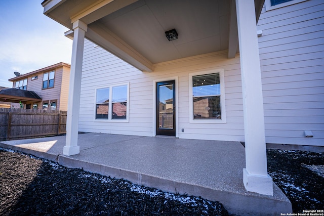 entrance to property with a patio area