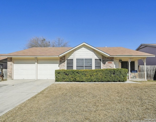 ranch-style home with a garage and a front lawn