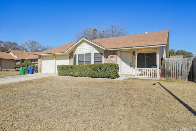 single story home with a garage and a front lawn