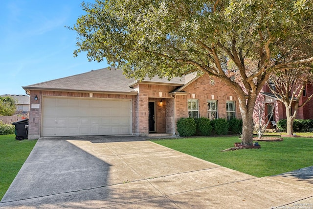 view of front of home with a garage and a front lawn