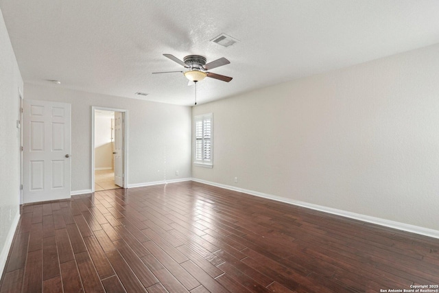 unfurnished room featuring dark wood-type flooring, a textured ceiling, and ceiling fan